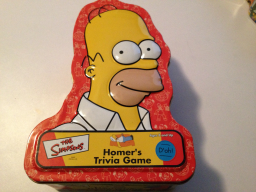 Homer's Trivia Game (large tin shaped like Homer)